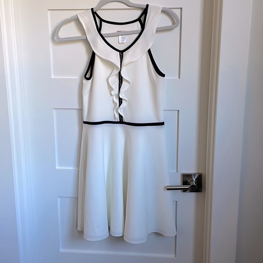 White Sally Miller dress with black trim accents